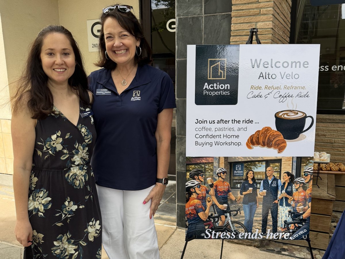Heather Heydet beside Action Properties event signage at the Alto Velo cycling club ride